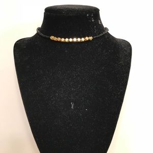 Black and gold beaded choker.